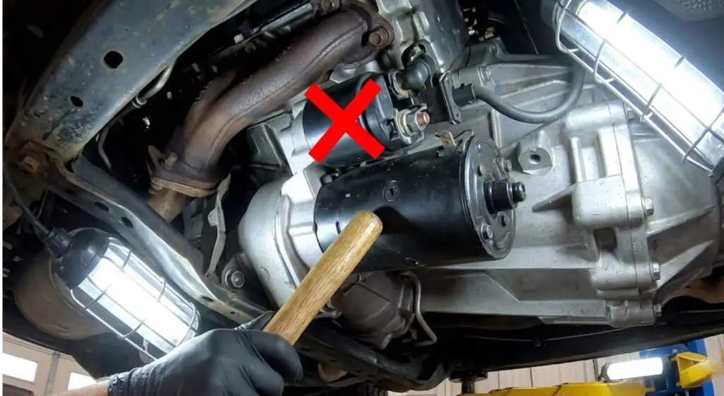 Annotated Dodge Ram starter motor showing the correct cylindrical body to strike with a hammer handle — Proves the safe location to perform a tap test without damaging the fragile starter solenoid.