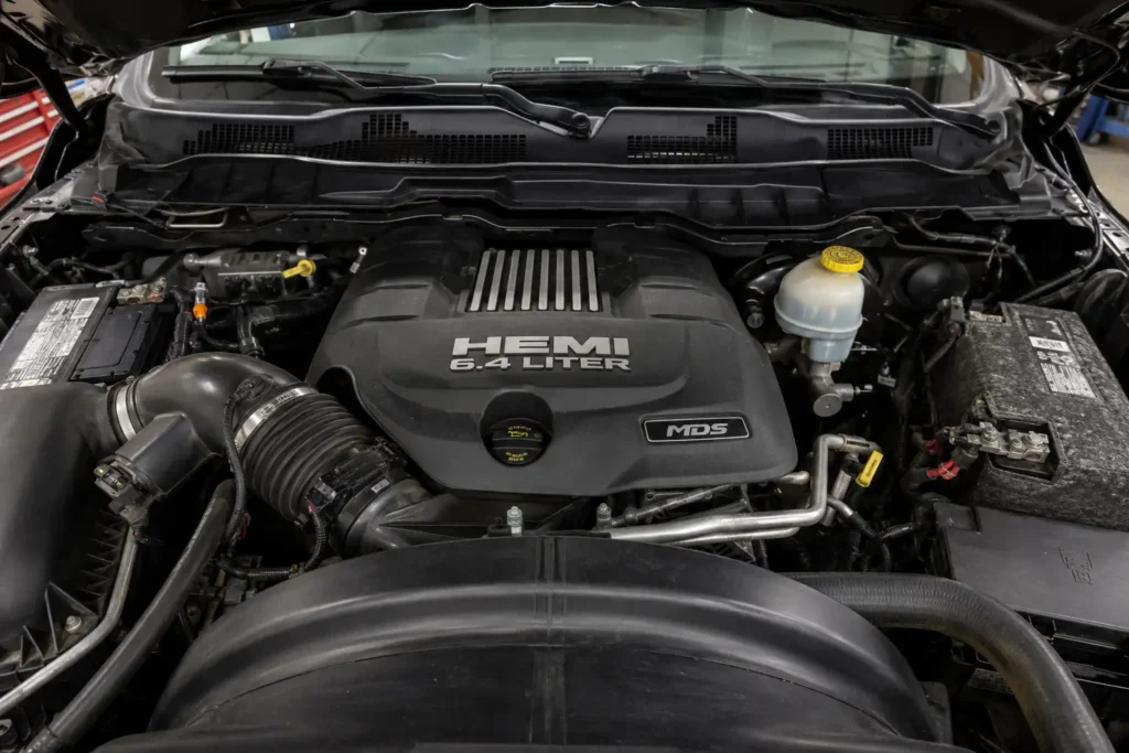 6.4 Hemi V8 engine bay in a 2015 Ram 2500.
6.4 Hemi engine bay, Ram 2500 engine compartment, HEMI V8 truck engine, Mopar 392 engine