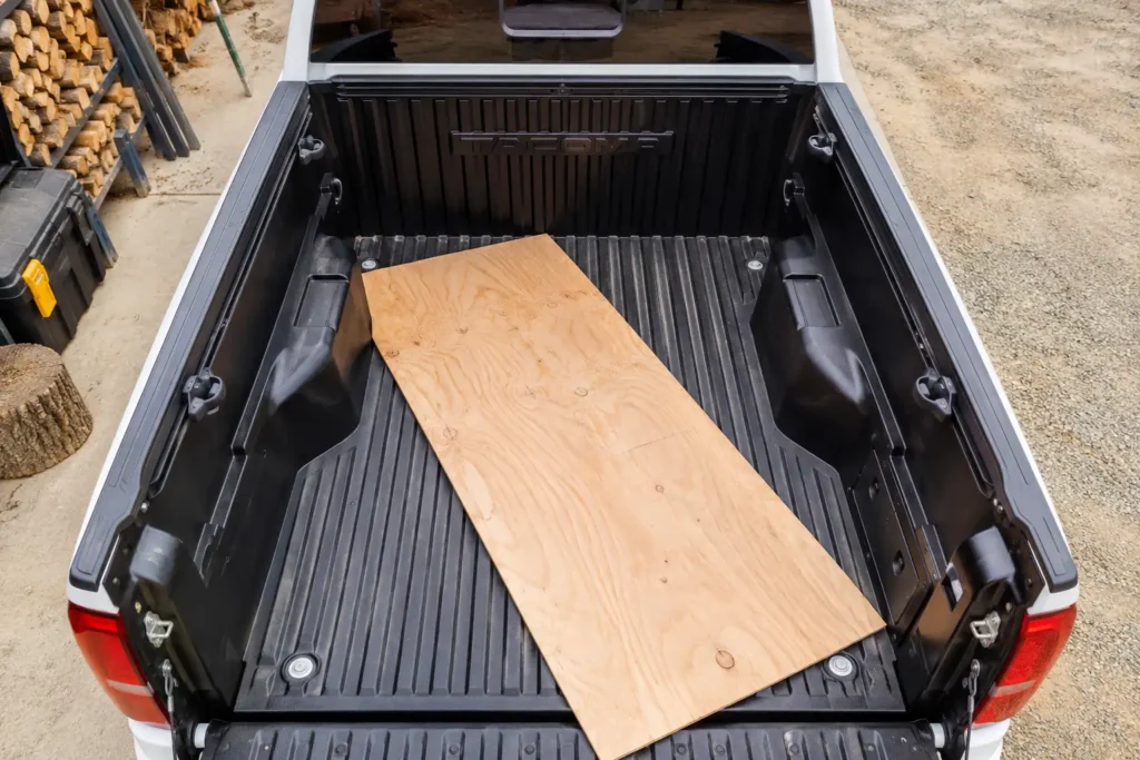 Toyota Tacoma bed wheel well width with plywood sheet loaded