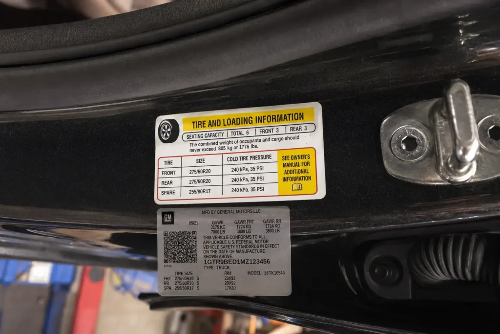 GMC Sierra 1500 door jamb label showing tire and loading information