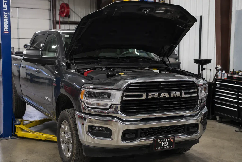 Ram 2500 6.7 Cummins truck with hood open for an oil capacity check