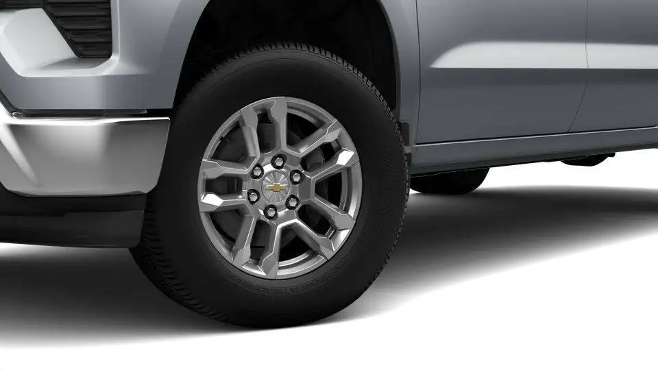 Chevy Silverado 1500 factory style wheel and tire viewed from a low front angle.